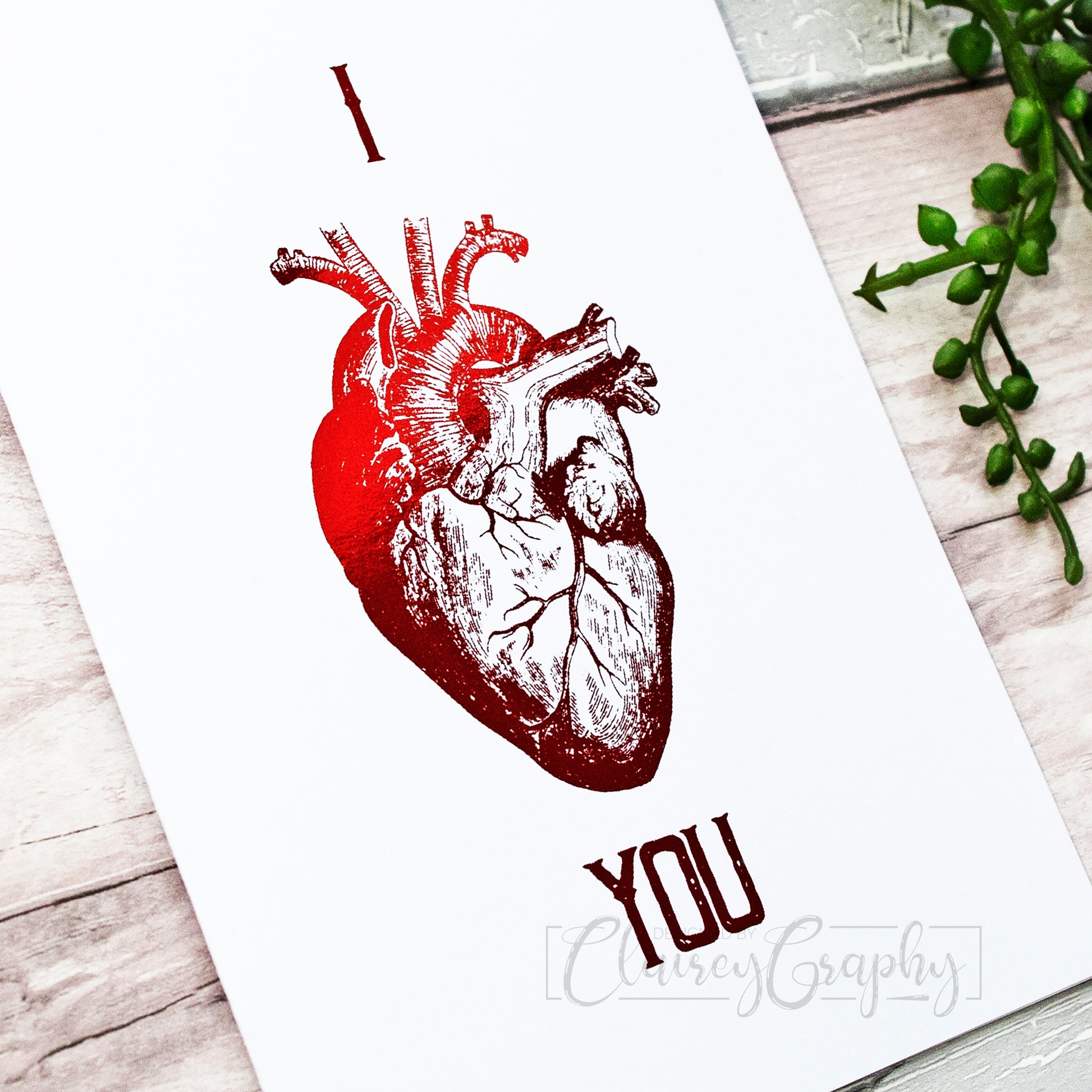 I Heart You Anatomical Heart - red foil, close up. 7x5 inch handmade foil card by ClaireyGraphy, printed by Bright Bear Designs