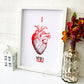 I Heart You Anatomical Heart- red foil, side view. Handmade foil print by ClaireyGraphy, printed by Bright Bear Designs