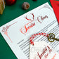 Personalised Letter from Santa. Close up of the red foiled antler letterhead which reads: "From the desk of Santa Claus". Printed on smooth ivory card stock and foiled in a stunning red and gold, each letter is personalised to the child/children.