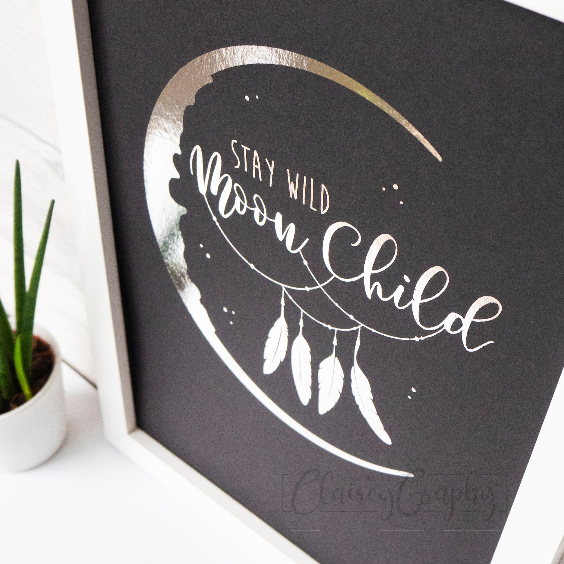 Stay Wild Moon Child - Silver on black, detail. Handmade foil print by ClaireyGraphy, printed by Bright Bear Designs