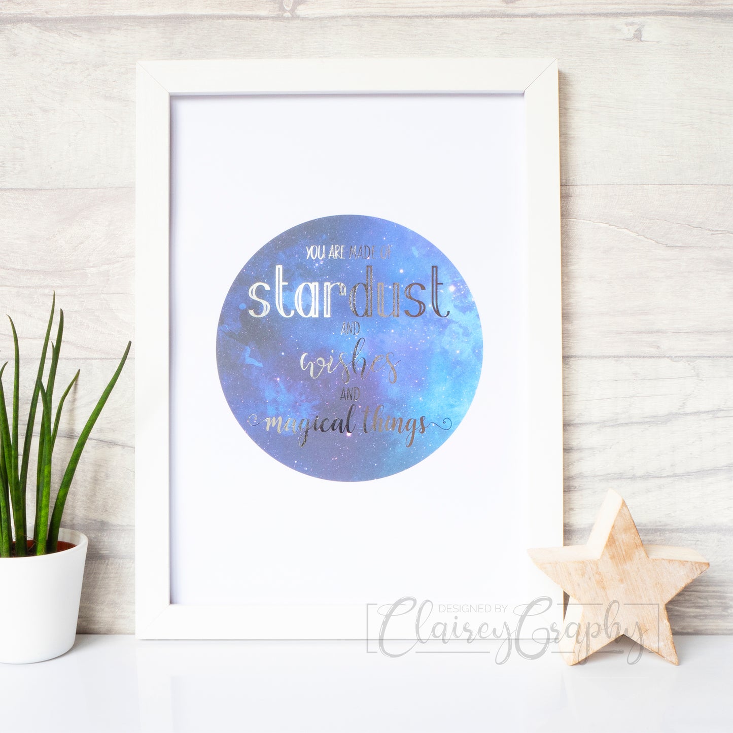 You Are Made of Stardust - silver on watercolour, front view. Handmade foil print by ClaireyGraphy, printed by Bright Bear Designs