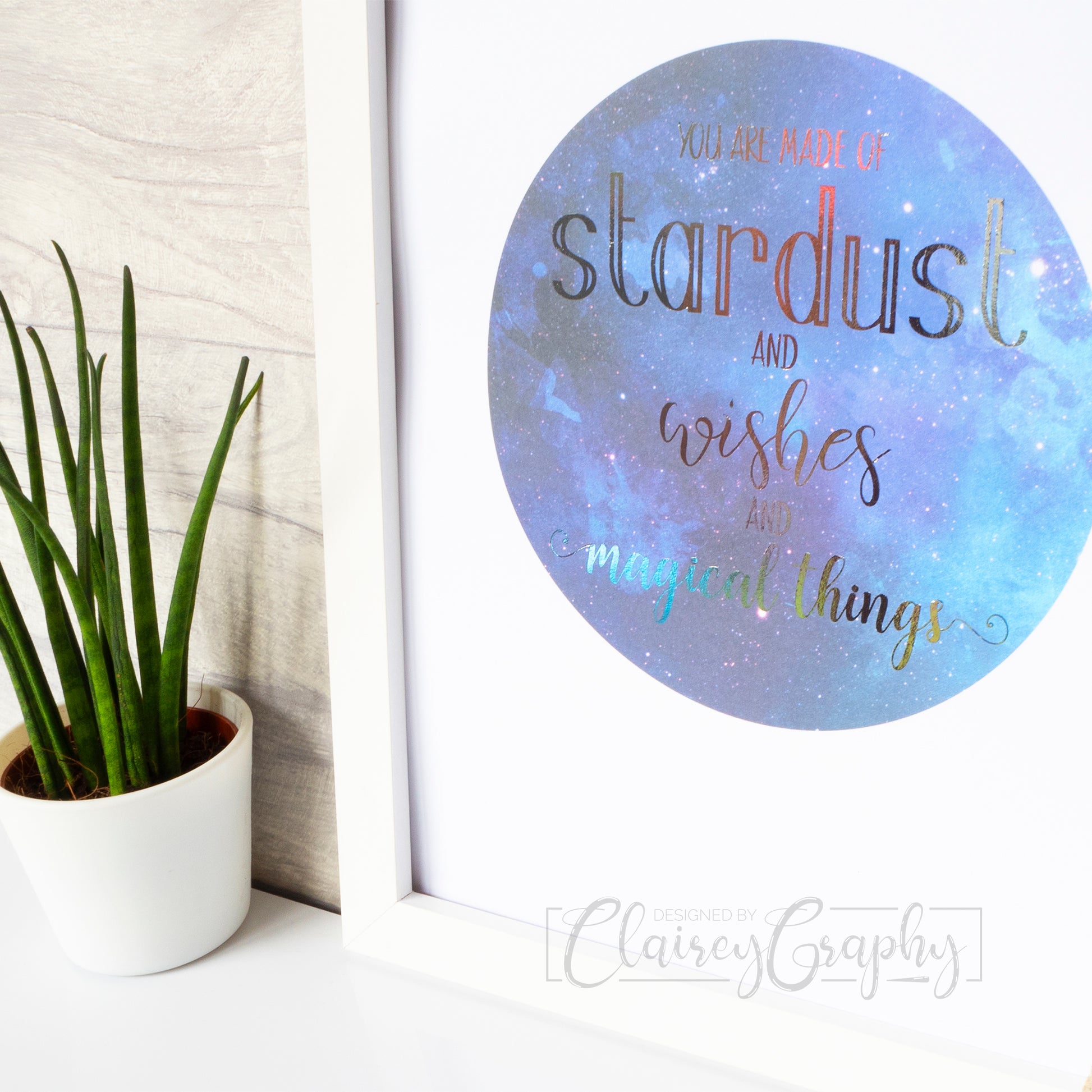 You Are Made of Stardust - silver on watercolour, side view. Handmade foil print by ClaireyGraphy, printed by Bright Bear Designs