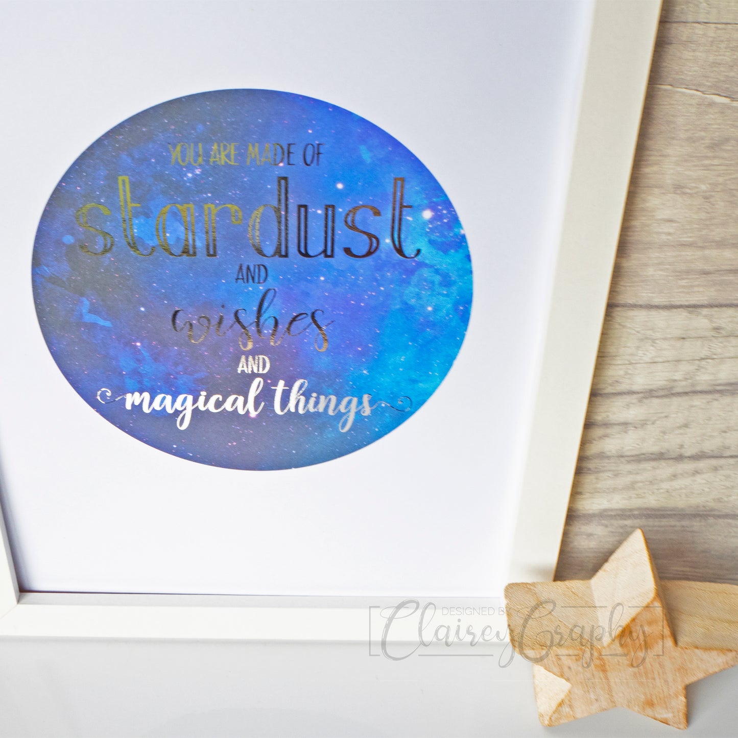 You Are Made of Stardust - silver on watercolour, top view. Handmade foil print by ClaireyGraphy, printed by Bright Bear Designs